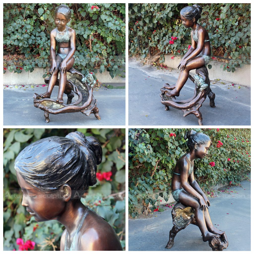 menina com escultura de rã touro