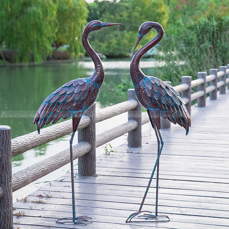 Figuras de grúa de latón vintage