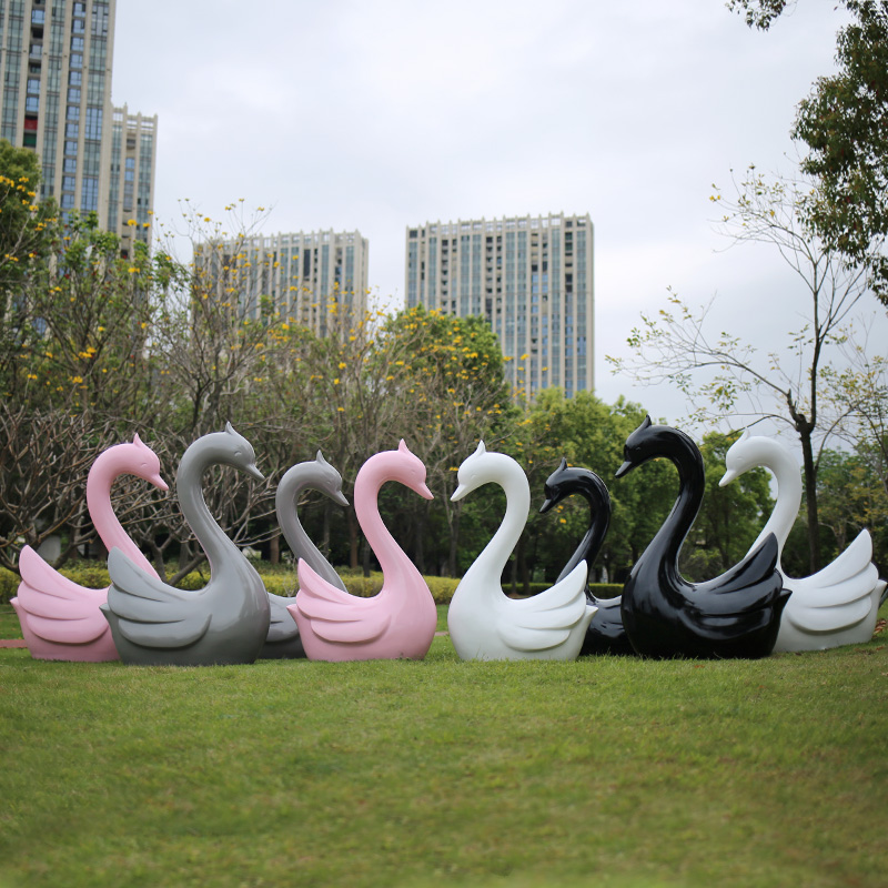 statua coppia di cigni