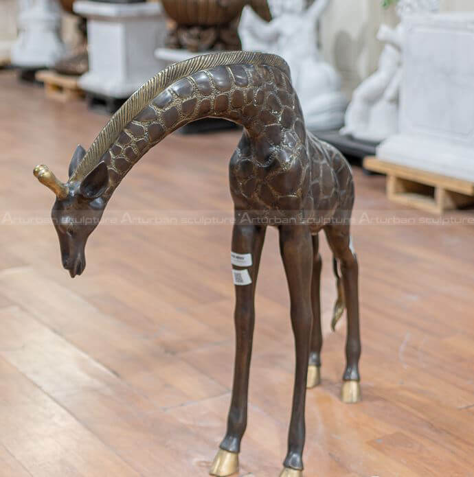 large brass giraffe statue