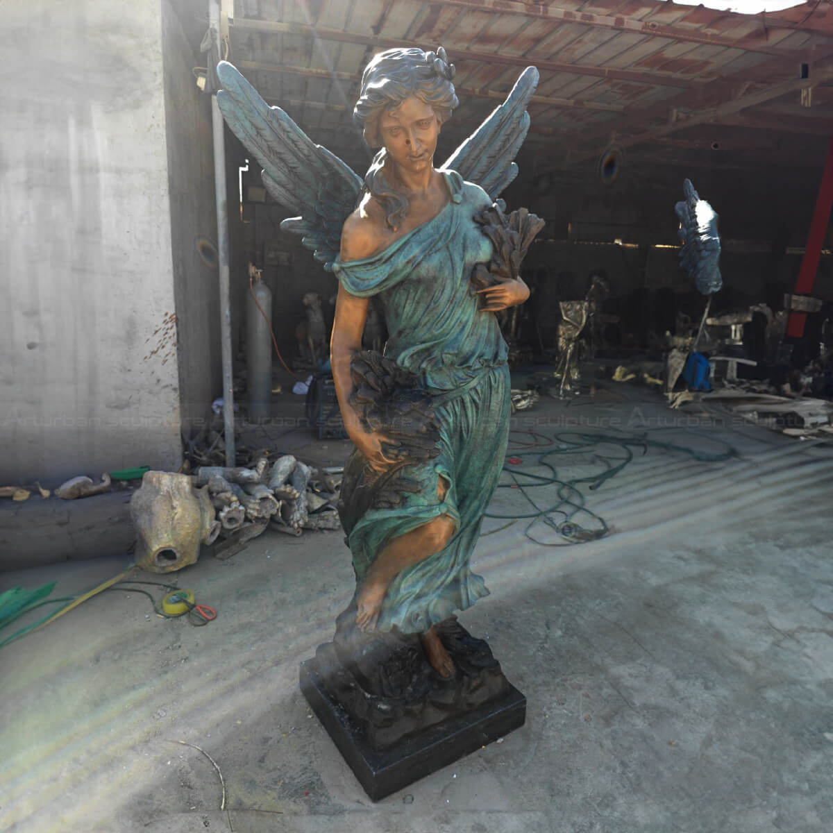 A graceful Angel Art Sculpture holding wheat ears