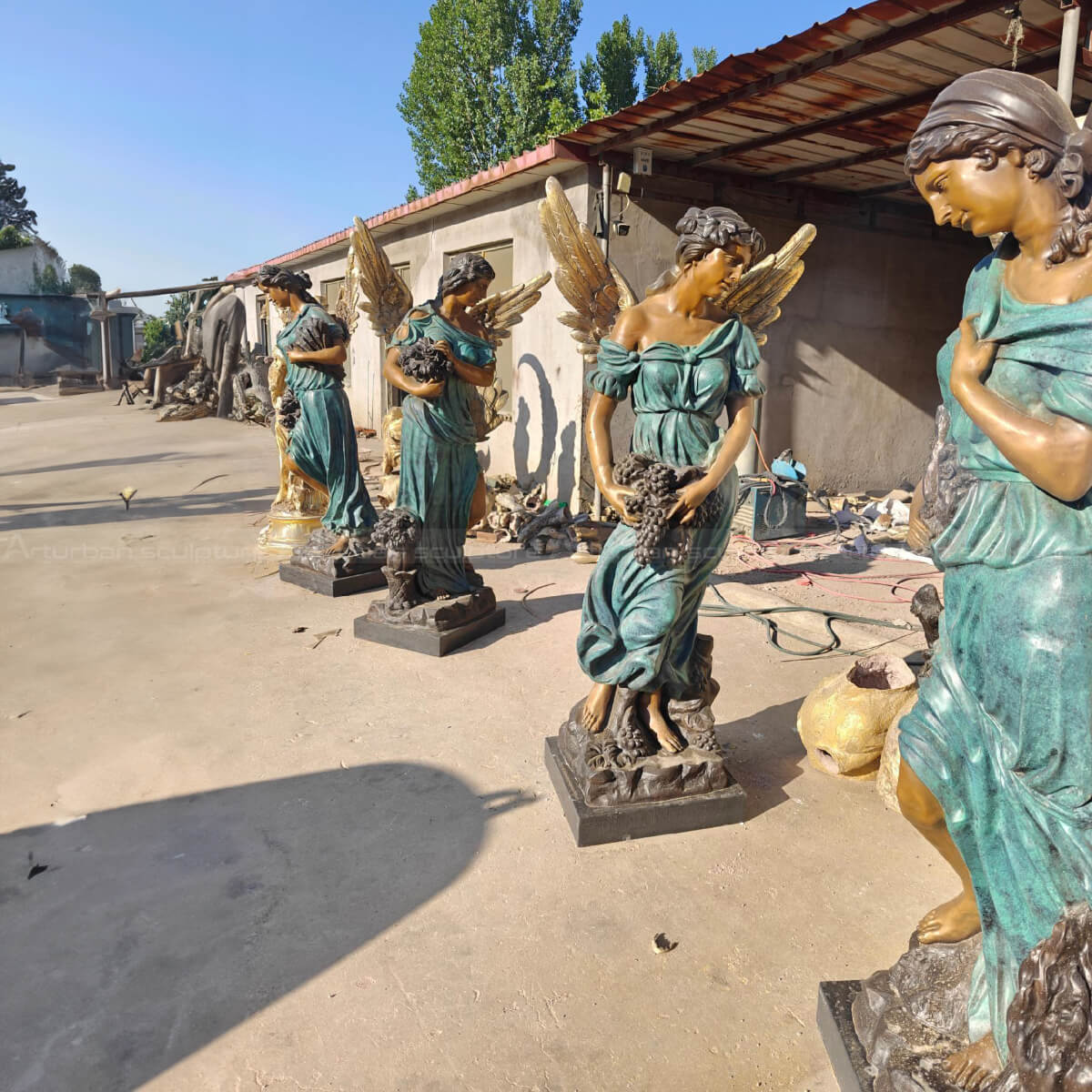 A group of Angel Art Sculptures standing together