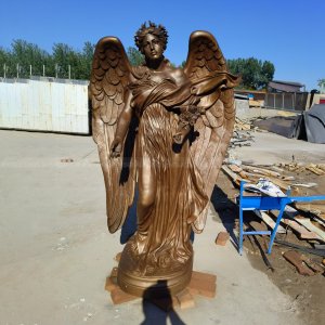 Angel Garden Sculpture holding a flower bouquet