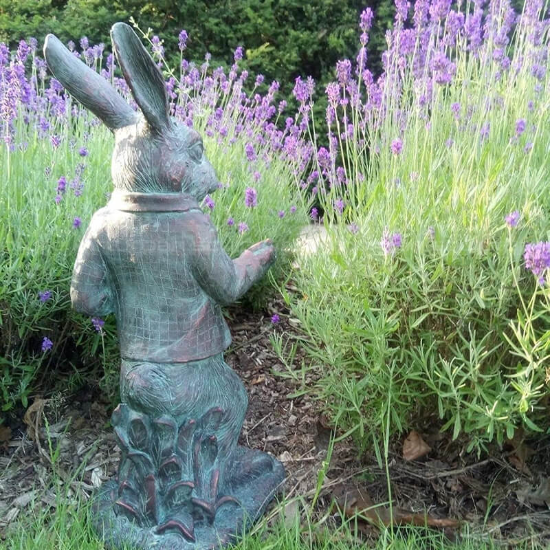 Back view Alice Wonderland rabbit garden statue