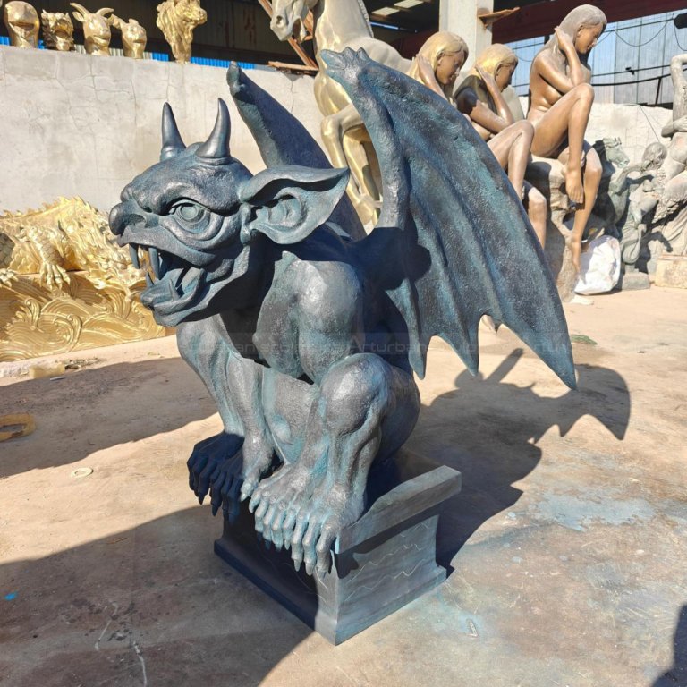 Gargoyle Lawn Statue crouching with its wings spread wide and a fierce expression