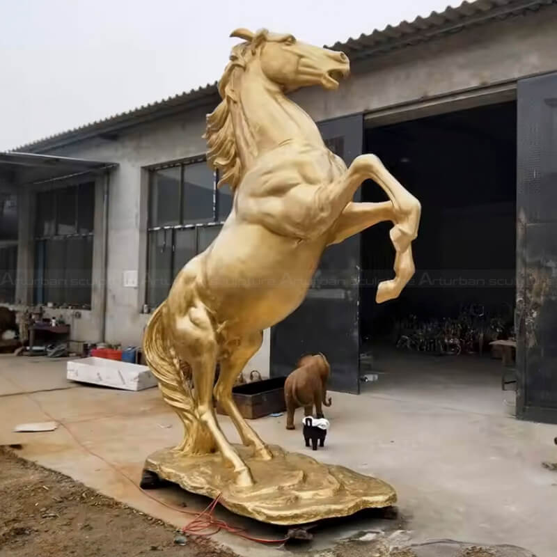 Golden Horse Sculpture in a rearing stance