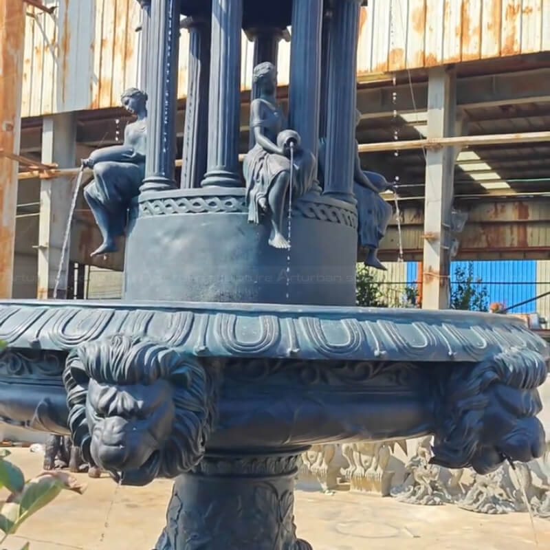 Greek Style Fountain with lion head spouts, female figures holding water vessels, and children sculptures on top