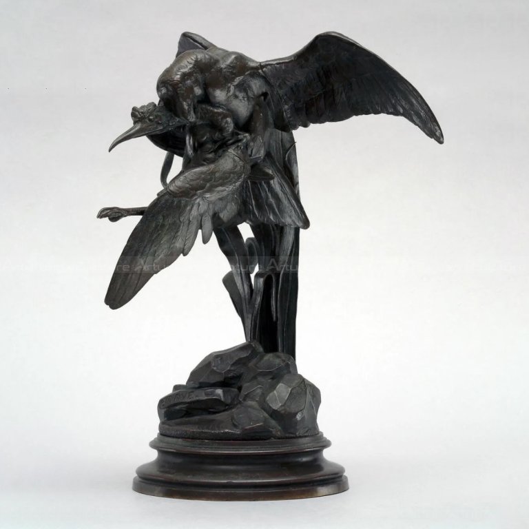 a bird of prey capturing a heron statue front view
