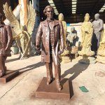 bronze statue of Jefferson F. Davis standing with a scroll