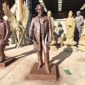 bronze statue of Jefferson F. Davis standing with a scroll