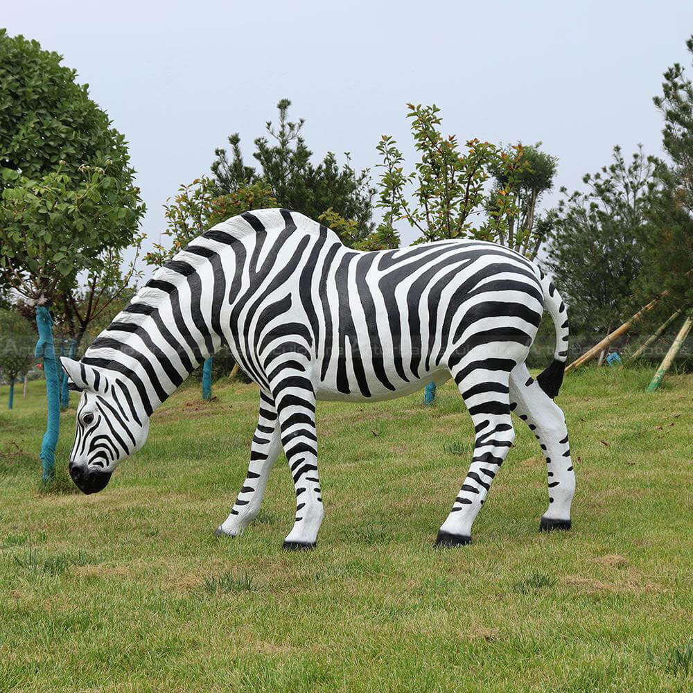 striped zebra fiberglass statue eating grass