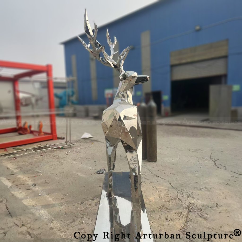 back view of stainless steel geometric deer statue with head turnded to the side