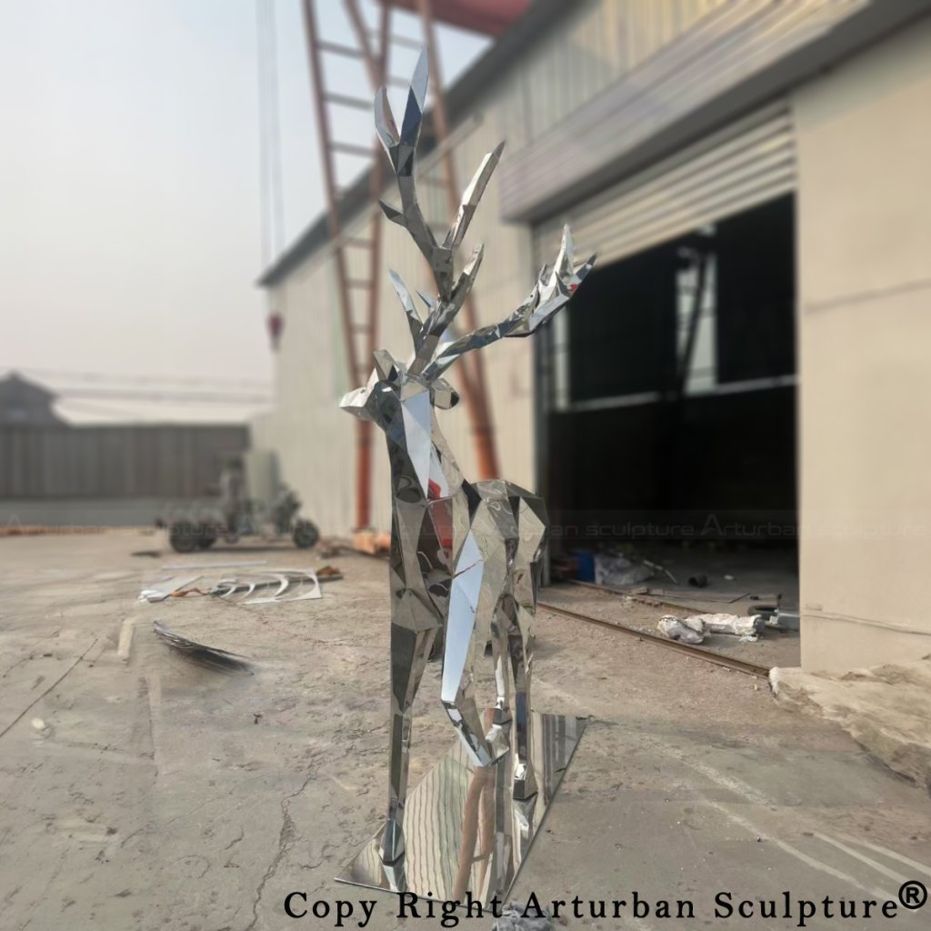 front view of a mirror stainless steel geometric deer sculpture