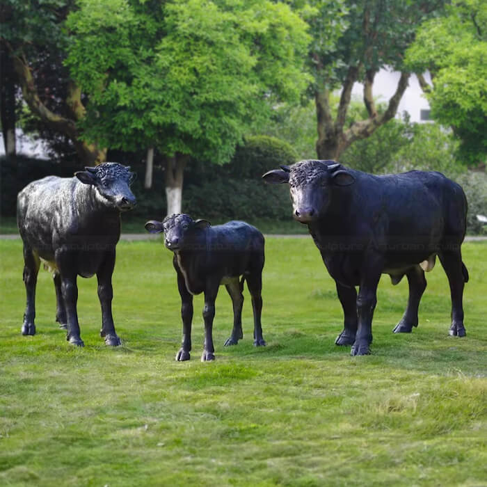 A family group of black Angus cattle Cow Sculpture for Sale