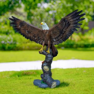 Bald Eagle Yard Décor showing eagne standing on branch with wings wide spread