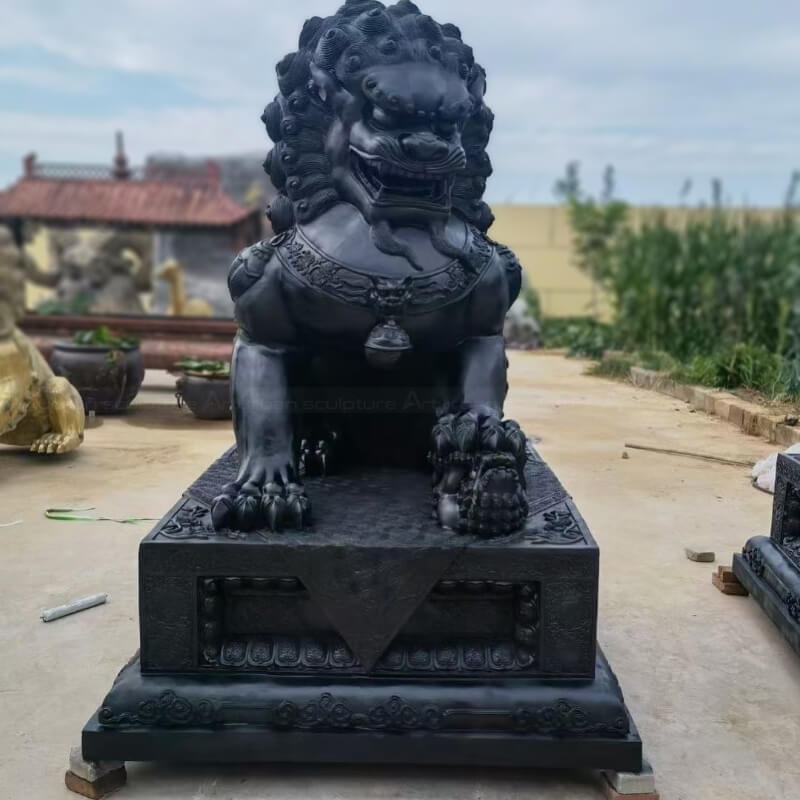 Chinese Lion Dog Ornaments with its mouth open, placing its left paw on a lion cub
