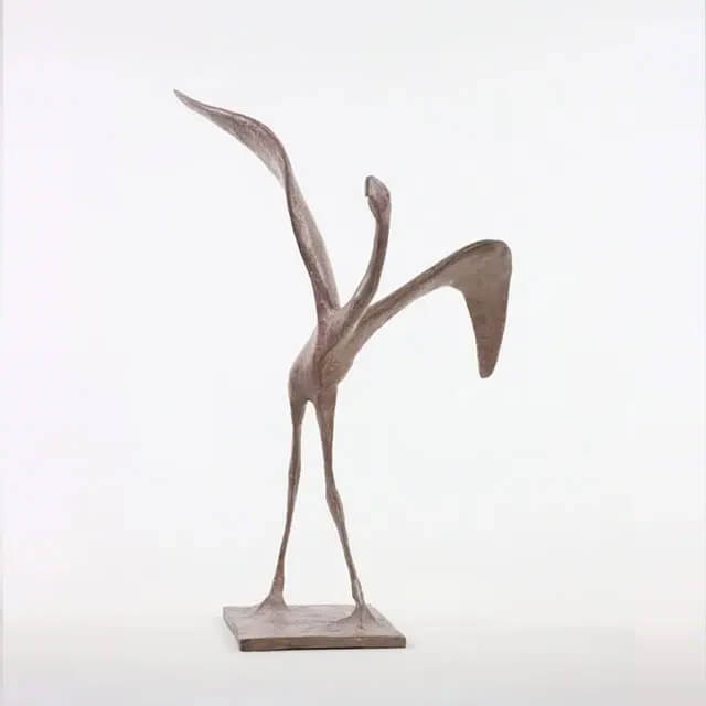 Contemporary Bird Figurine of a abstract flamingo by Pierre Yermia, featuring elongated legs and exaggerated wings raised in a poised, upward motion
