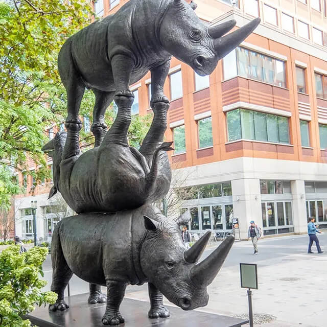 The Last Three Statue by Gillie and Marc Schattner featuring three stacked rhinoceroses, representing the last Northern White Rhinos