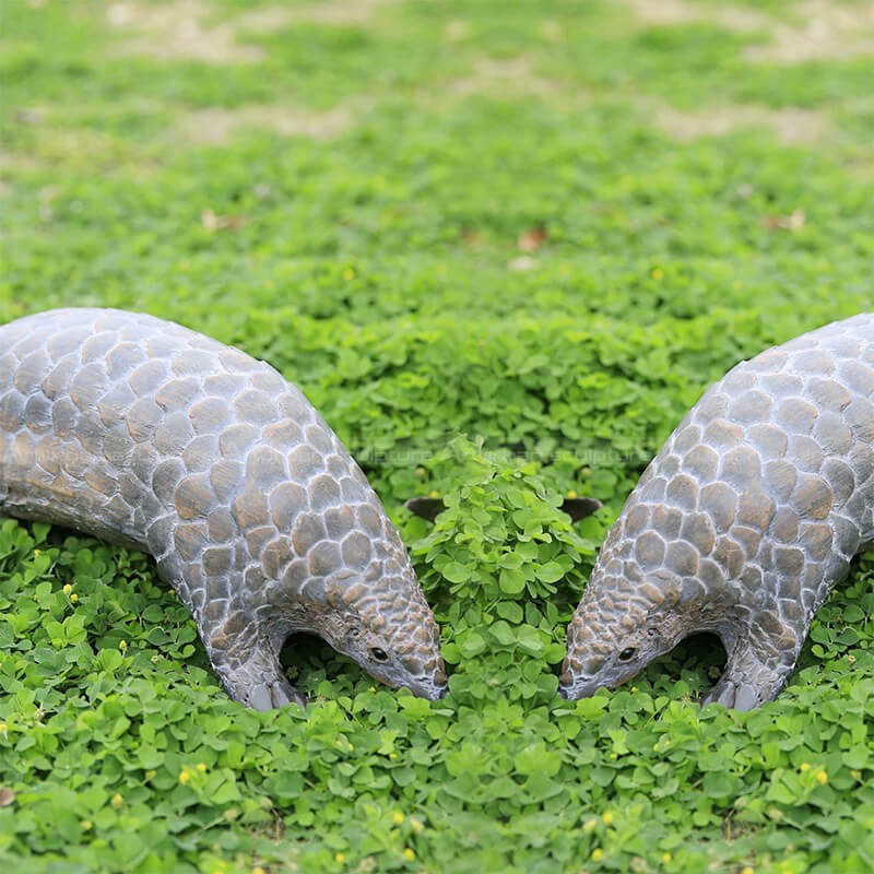 a pair of Pangolin Statues depict realistic scale texture