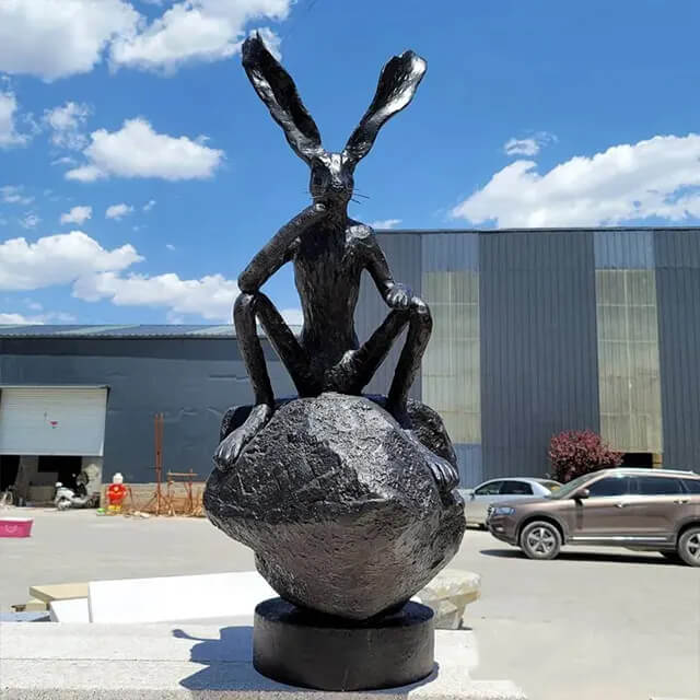 front view of Barry Flanagan Hares, chin on paw, deep in thought statue for Sale