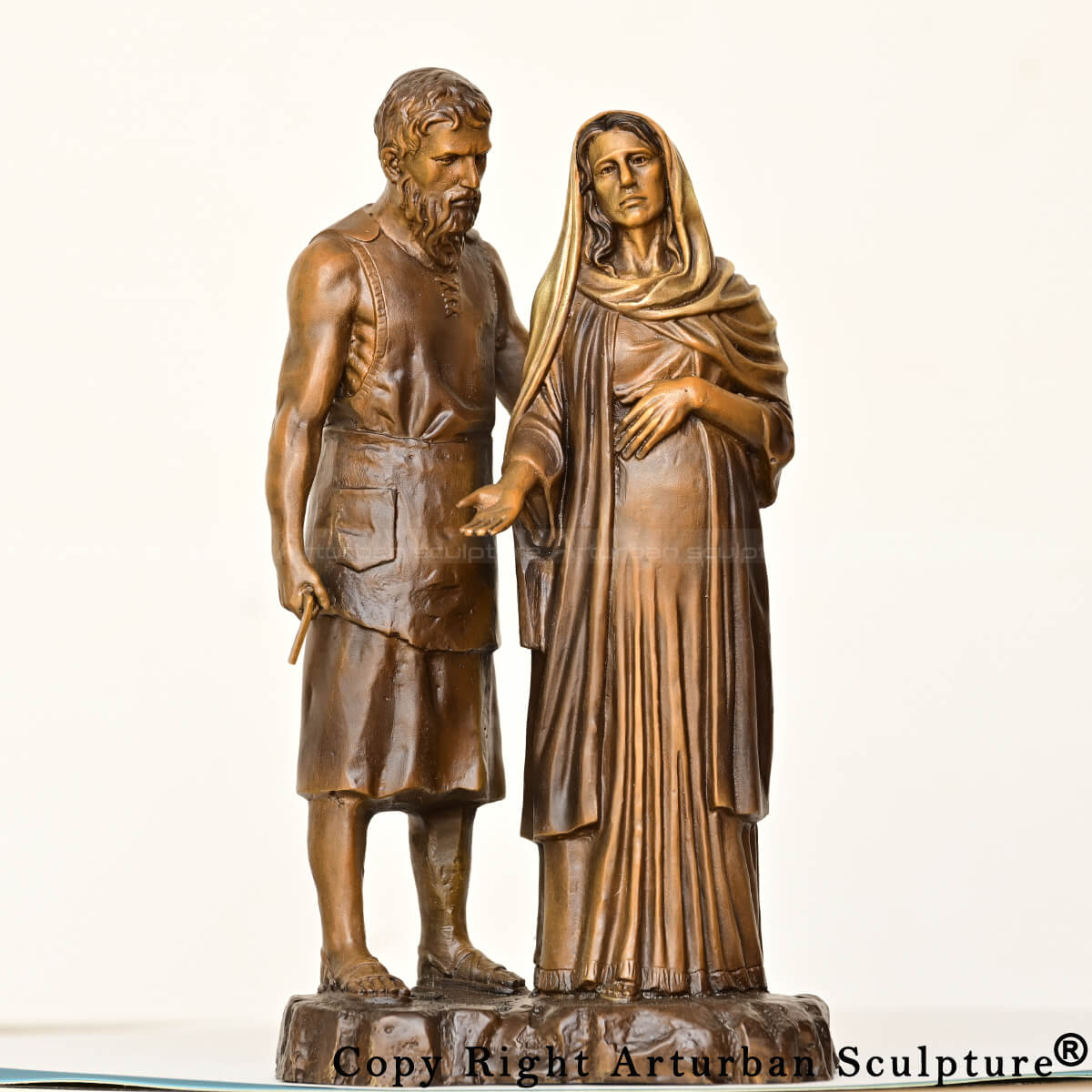 Frontal view of Mary and Joseph bronze statue