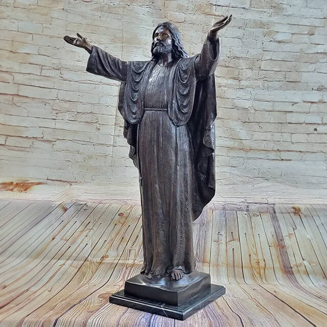 Bronze Statue of Jesus standing barefoot on a square base