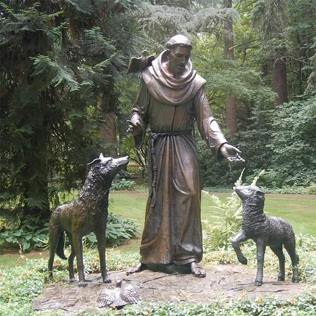 St Francis of Assisi Statue with Animals standing peacefully in a forest garden