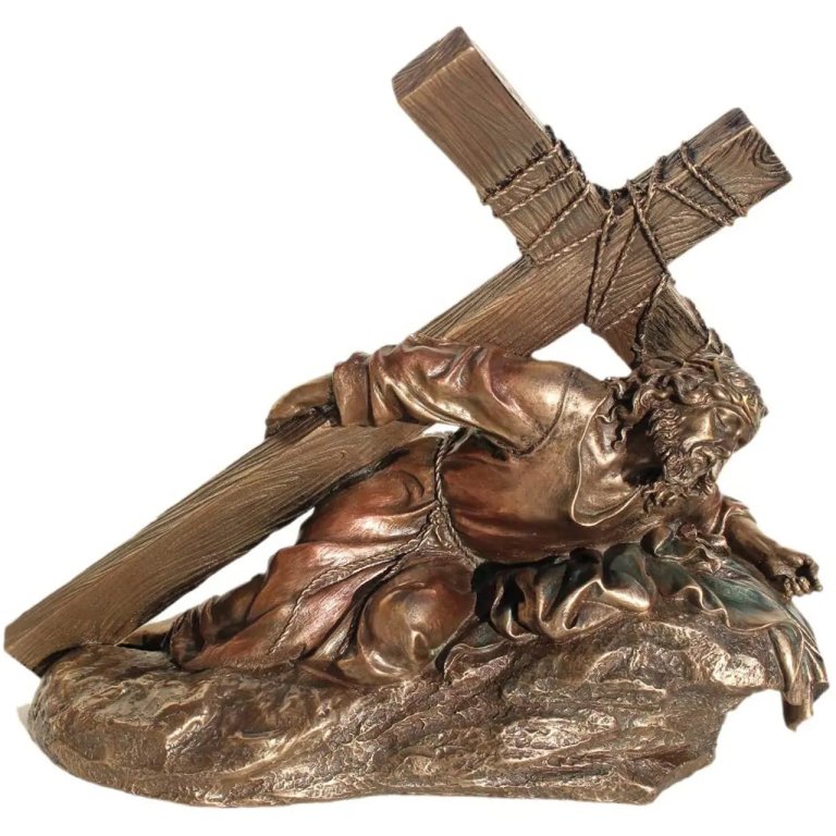 Way of the Cross Sculpture depicting Jesus Christ collapsing under the weight of the cross