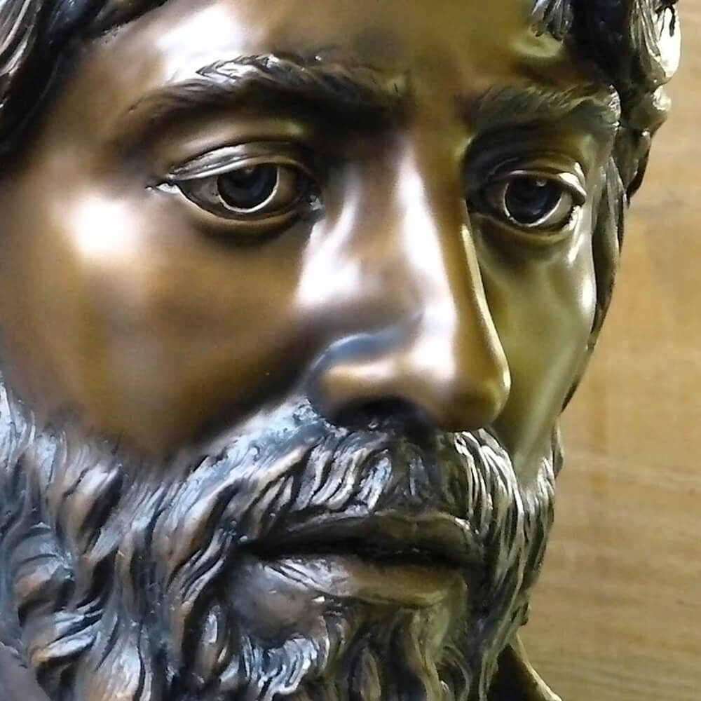 Close-up of Jesus face in bronze Statue of Crucifixion with expressive sorrow