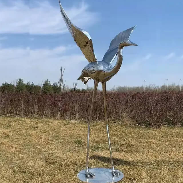 Tall stainless steel Metal Crane Garden Sculpture standing with wings open