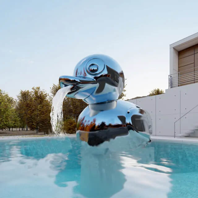 Whimsical stainless steel Duck Garden Fountain spouting water from its beak