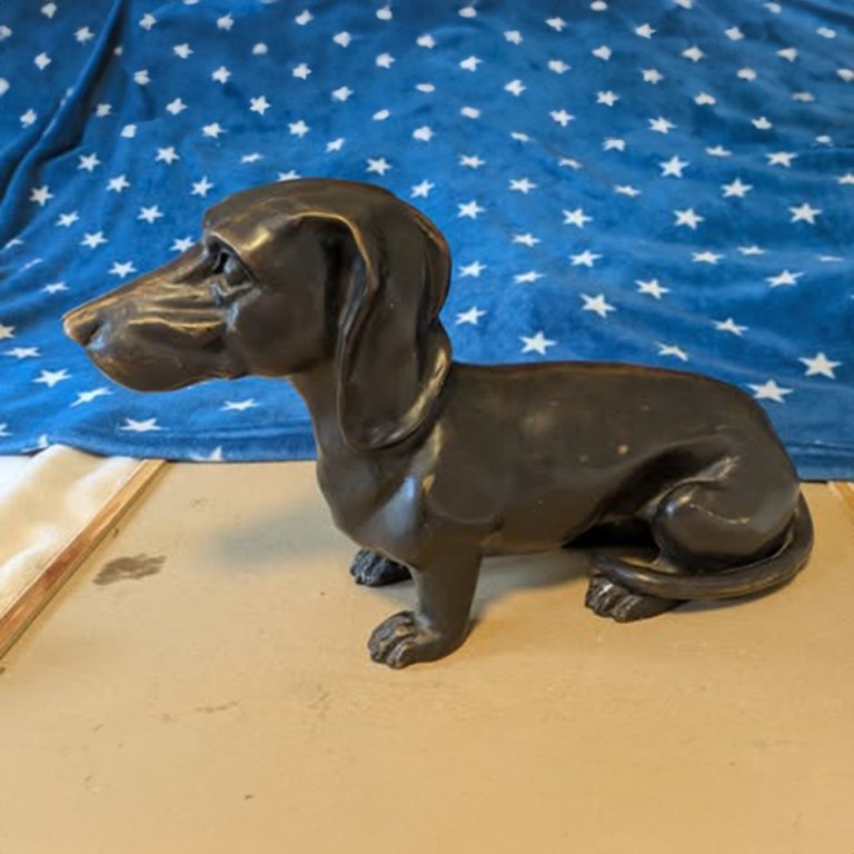 Bronze Dachshund Memorial Statue with detailed sitting posture and long ears