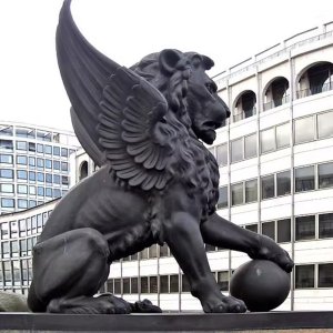 Bronze Large Lion Statue with Wings, realistic mythical creature with powerful lion form, spread wings and paw resting on sphere