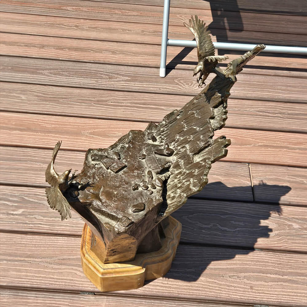 Eagle Bird Sculpture in bronze with detailed wings and dramatic cliff design