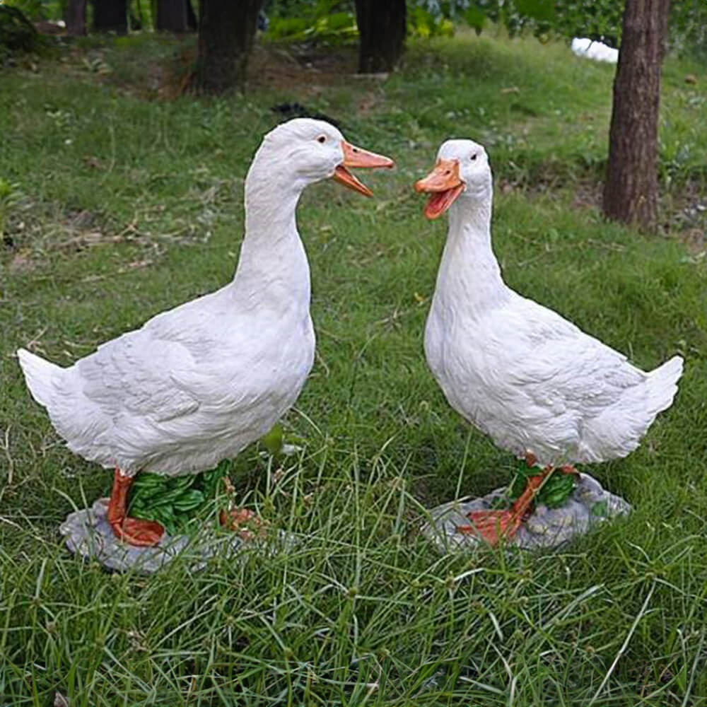 Fiberglass Duck Family Lawn Ornaments of two standing ducks with vivid orange beaks and feet