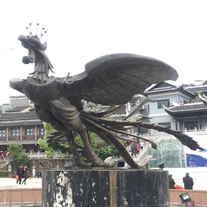 Large Bronze Phoenix Statue spreading its wings on a pedestal