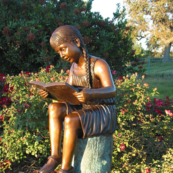 Bronze Girl Reading Book Statue side view