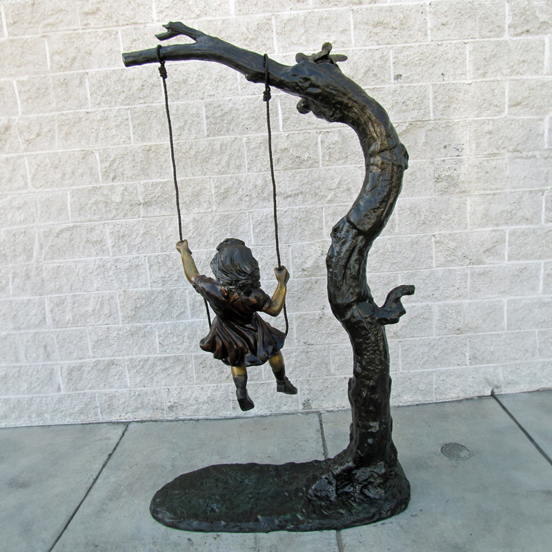 Bronze Girl on Swing Statue back view