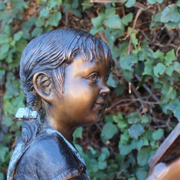 Bronze Reading Girl Statue face detail