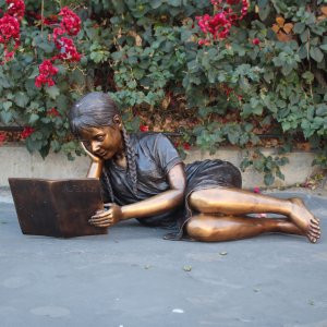 Bronze Sculpture Girl Reading in garden bronze