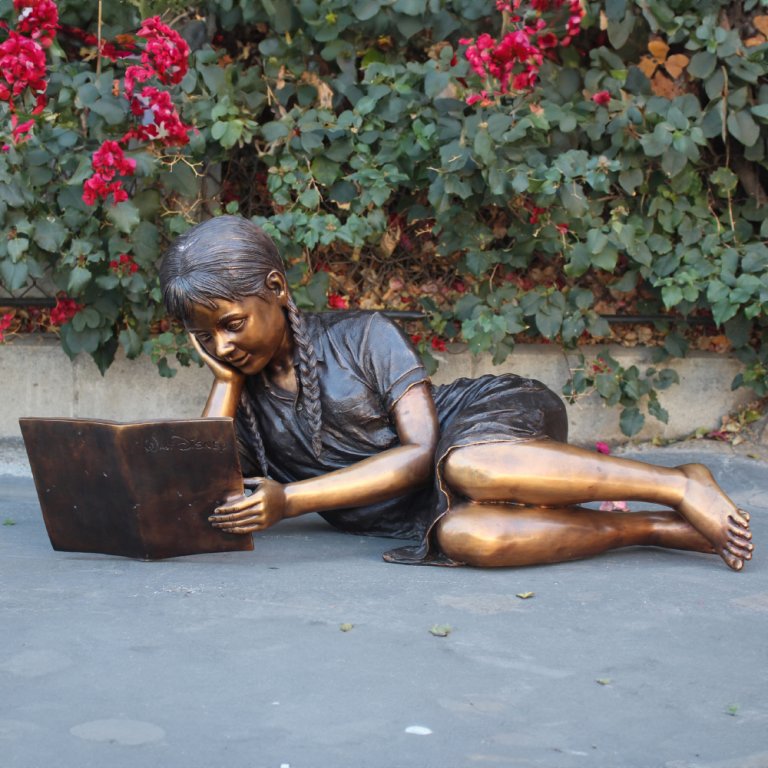 Bronze Sculpture Girl Reading in garden bronze