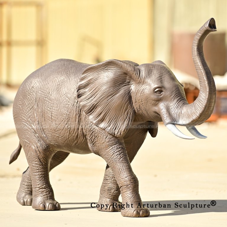 0 Walking African elephant sculpture with raised trunk