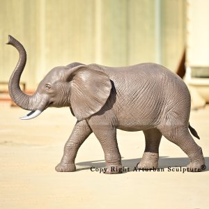 3 Bronze elephant with trunk up statue side view