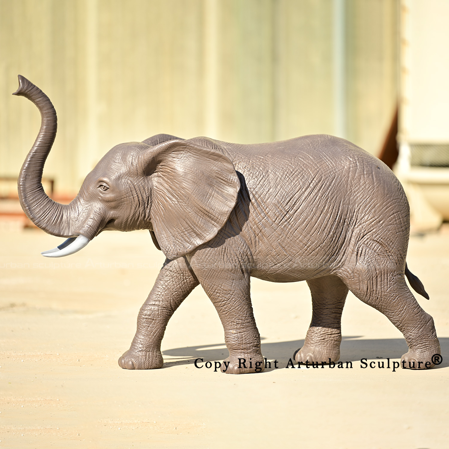3 Bronze elephant with trunk up statue side view