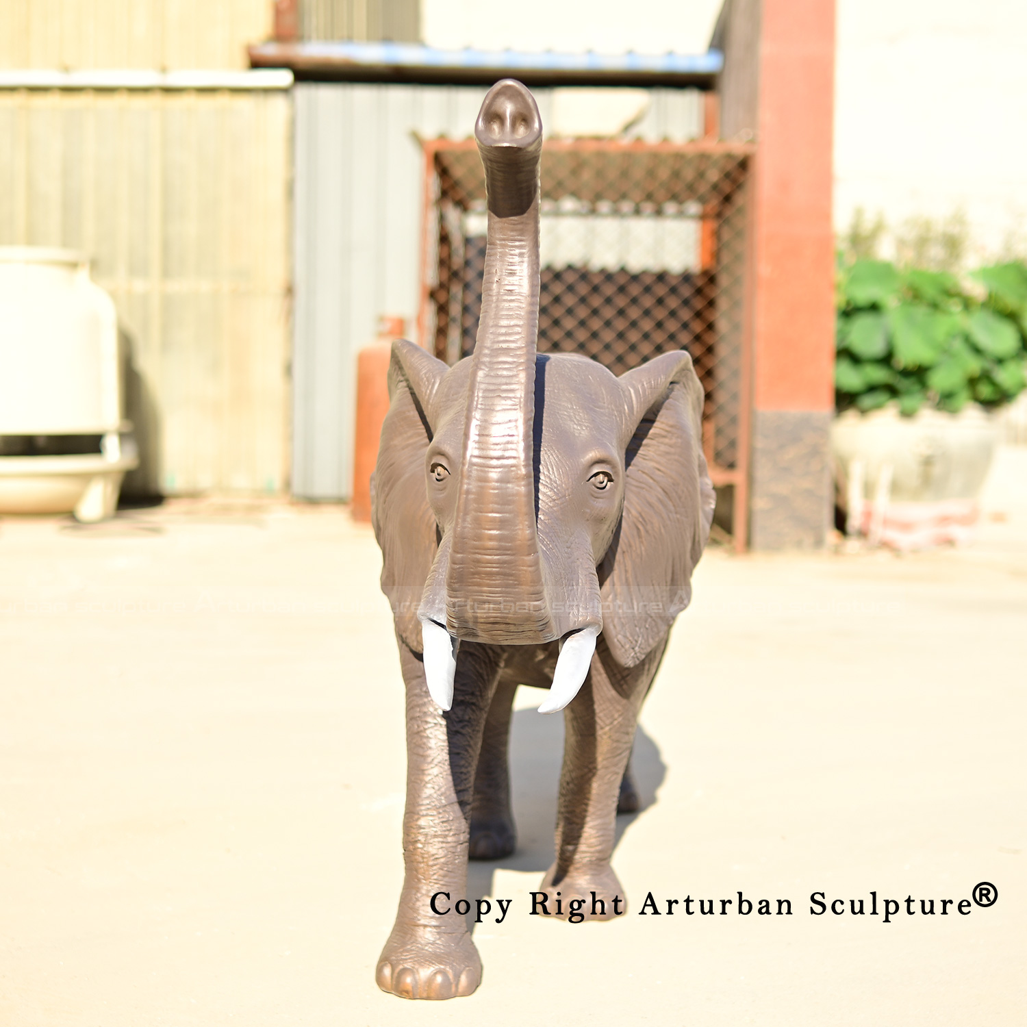 4 Bronze elephant with trunk up statue detail