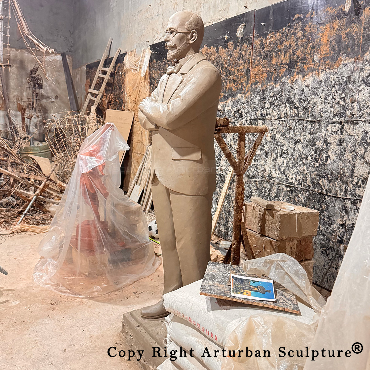5 Life-size clay politician statue in workshop