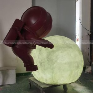Astronaut Holding Moon Statue fiberglass scene