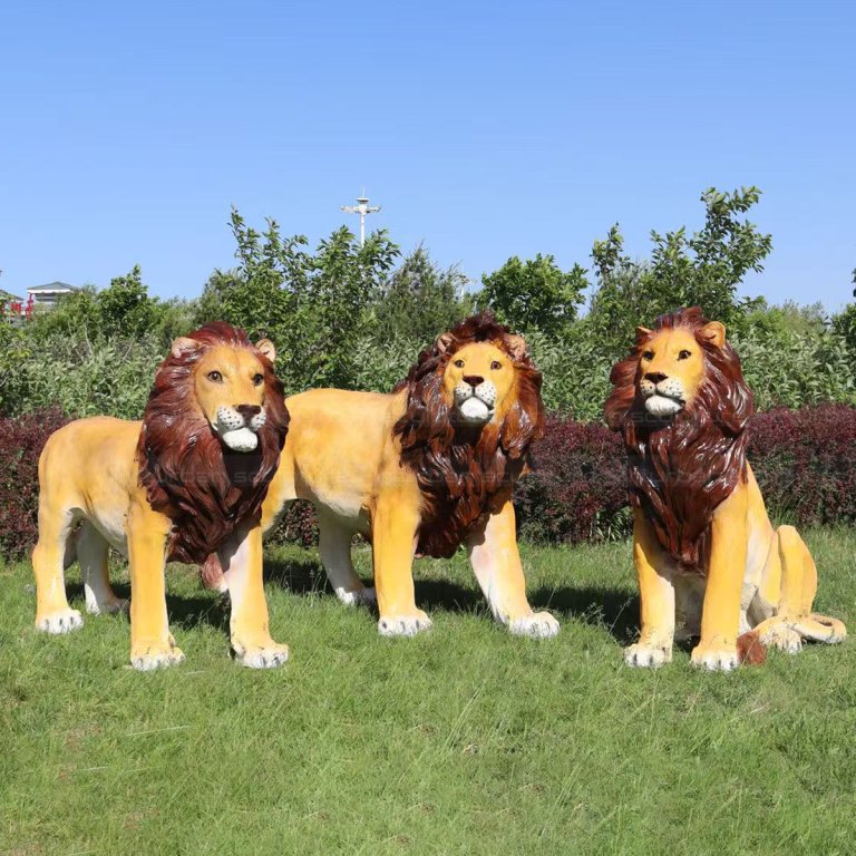 Three fiberglass Lion Lawn Statues outdoors