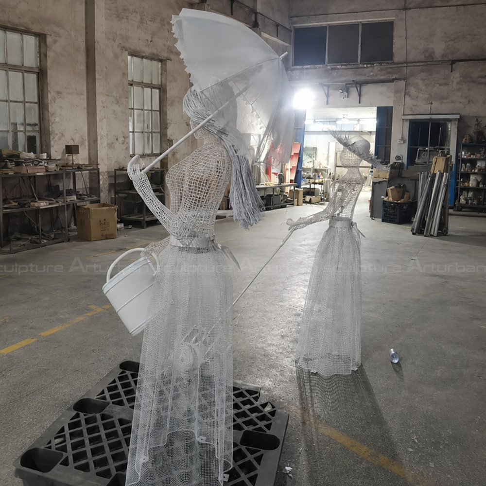 Wire Woman Sculpture holding garden umbrella