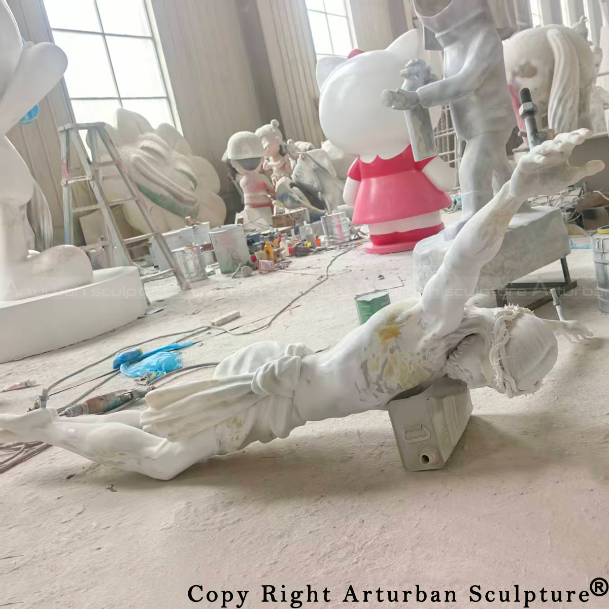 4 Fiberglass Jesus sculpture during surface finishing process